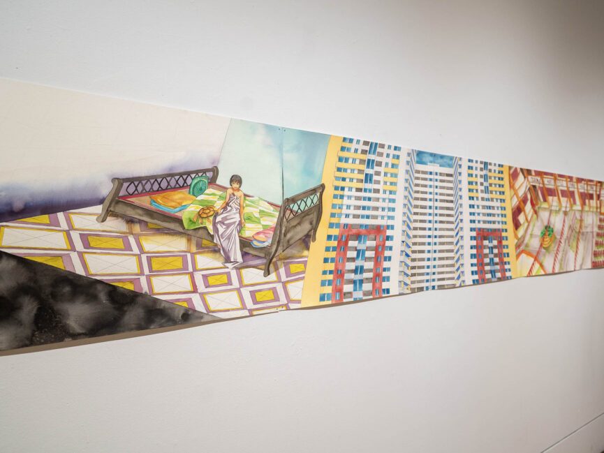 A mural hangs on the wall of a gallery.